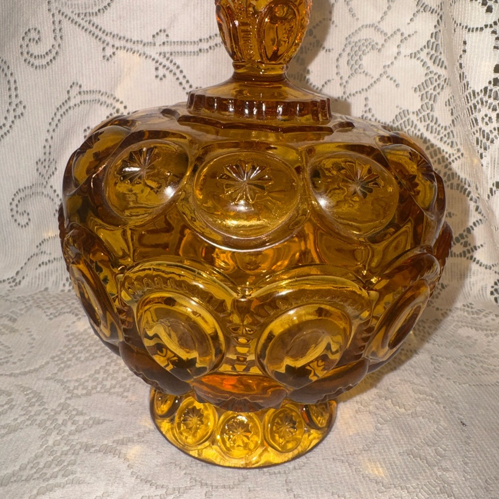 Le smith vintage Moon and Stars pattern amber candy dish with a lid.
